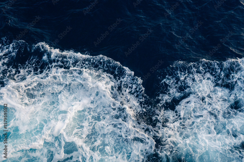 Fototapeta premium Sea water splash with foamy wave. Water surface texture. Tropical islands ferry travel. Cruiseliner trail. Ocean background. White water of sea. Marine travel banner template. Seaside vacation concept