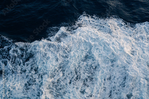 Sea water splash with foamy wave. Water surface texture. Tropical islands ferry travel. Cruiseliner trail. Ocean background. White water of sea. Marine travel banner template. Seaside vacation concept