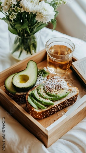 Delightful Avocado Toast Served With Tea and Blooms in Cozy Indoor Setting