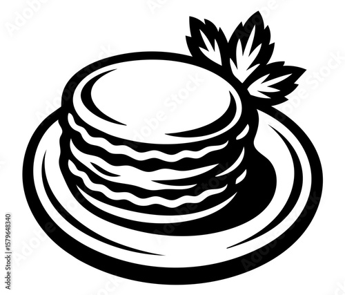 A stack of pancakes with a leaf on top