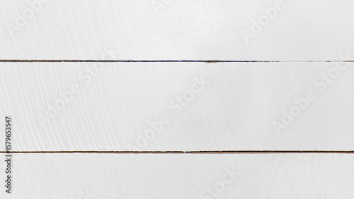Background photo of three textured white wooden planks with copy space.