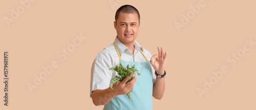 Young man in apron with fre...