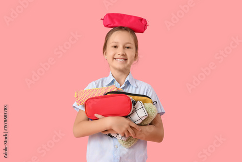 Little girl with pencil cas...