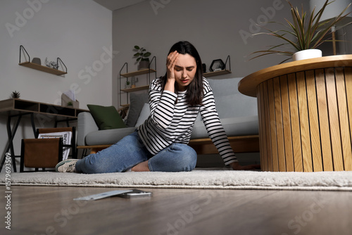 Depressed young woman with ...