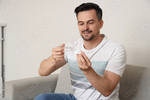 Young man with contact lens...