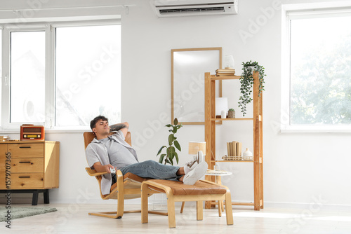 Young man with air conditio...