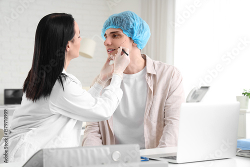 Female plastic surgeon mark...