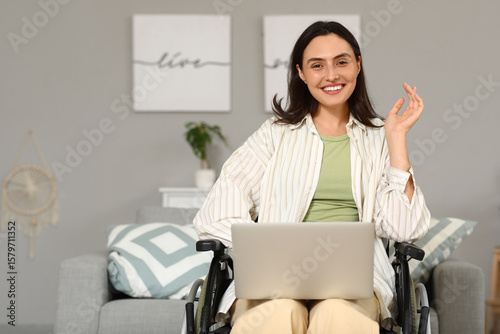 Young woman in wheelchair u...
