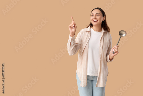 Young woman with ladle poin...