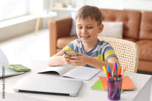 Cute little boy with modern...
