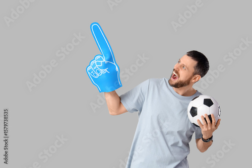 Happy young man with soccer...