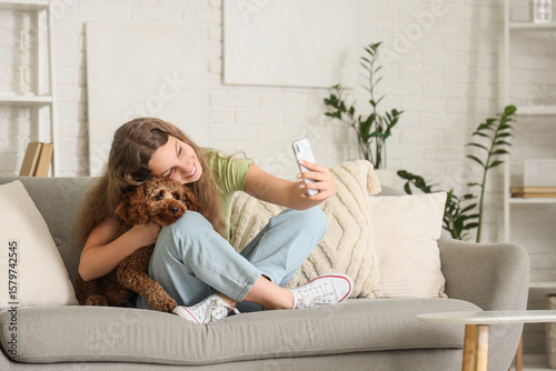 Teenage girl with Poodle do...
