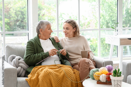 Senior woman knitting with ...