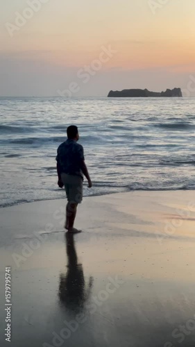 Full shot of mid aged man that walks in Zihuatanejo Shore