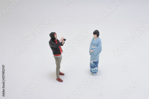Miniature Figures Displaying Cultural Interaction and Photography