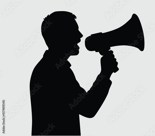 man shouting through megaphone