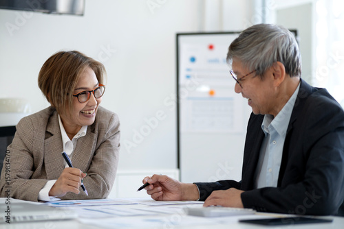 elder Business man woman  and executives in an office meeting