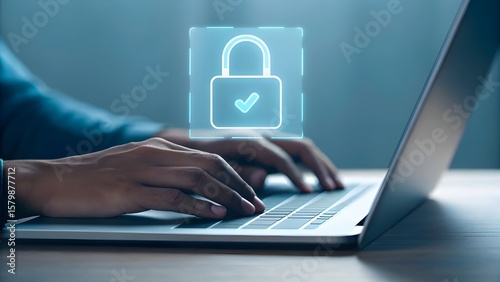 Person typing on laptop with digital padlock icon signifying online security and data protection