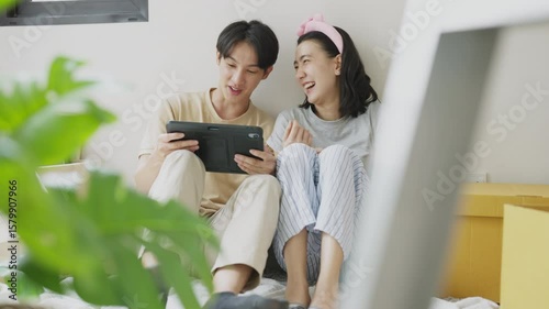 Happy Weekend: Bonding, Relaxing, and Planning Indoors.Planning and smiling through home's comforts and digital fun.
