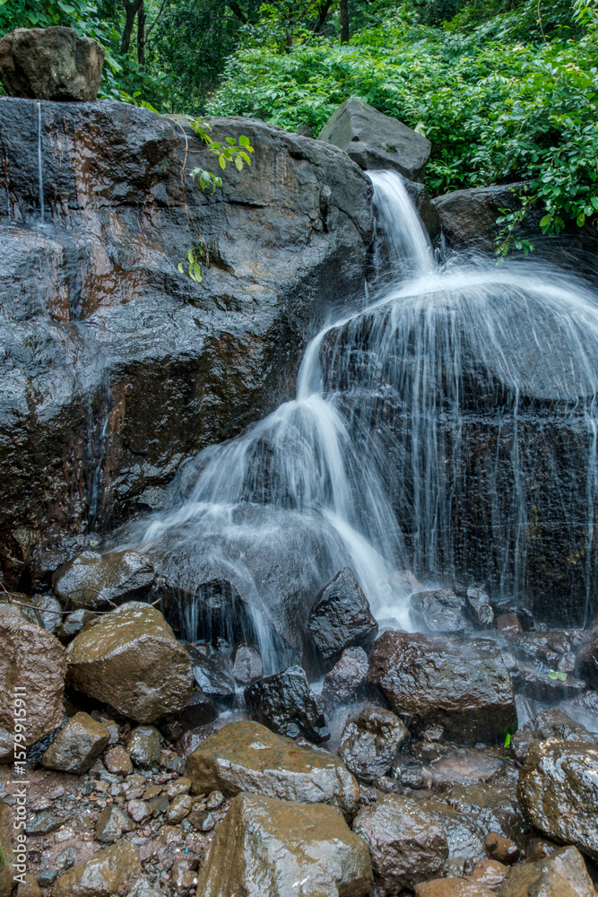 Fototapeta premium A waterfall during the monsoons near Pune India. Monsoon is the annual rainy season in India from June to September.
