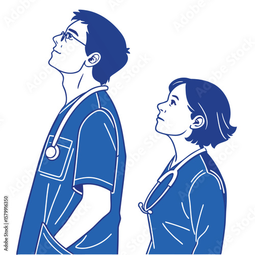 Two healthcare professionals wearing scrubs and stethoscopes looking upwards with hopeful expressions silhouette
