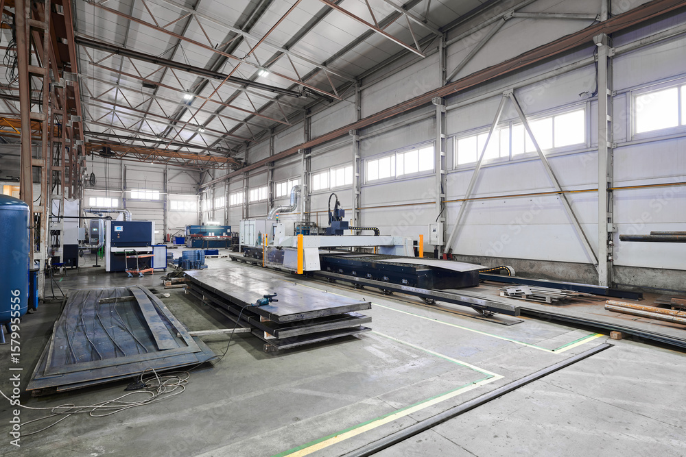 Fototapeta premium Metal sheets processing workshop with modern equipment