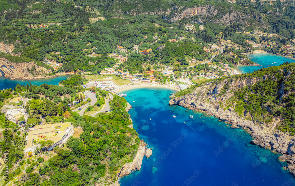 Fototapeta premium Agios Spiridon Beach with crystal azure water and beach with scenery of coastline of Corfu island near Monastery of Paleokastritsa, Ionian sea in Greece