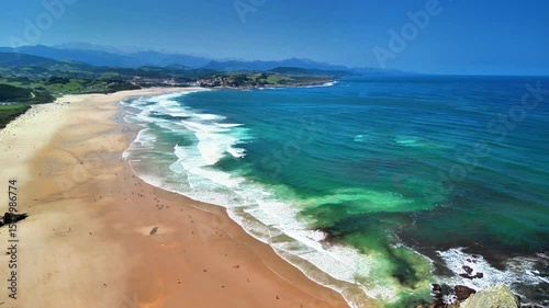 Wallpaper Mural Breathtaking drone footage beautifully capturing tranquil waves softly lapping at golden sands beneath clear skies Torontodigital.ca