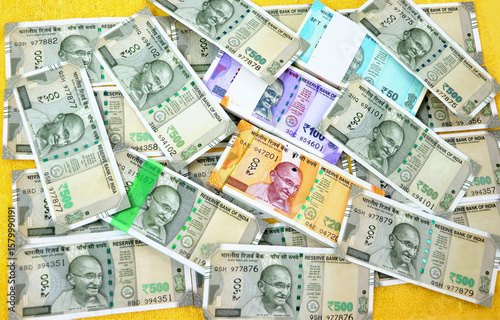 piles of new indian currency notes rupees 50,100,200 and 500