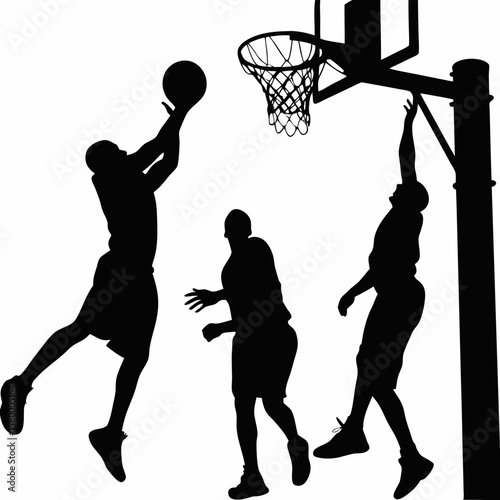 A High-Stakes Moment of Athletic Tension as Players Clash in Mid-Air Beneath the Hoop, Locked in the Grace and Grit of the Game