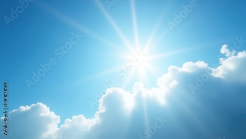 Bright sun shining through fluffy clouds.
