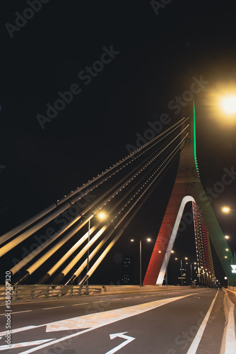 Night side view of the Alassane Ouattara Bridge in Abidjan – Modern architecture illuminated