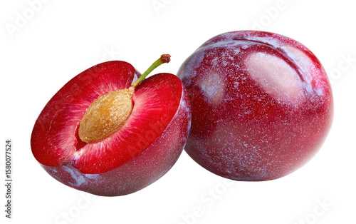 Fresh ripe plums one cut in half on transparent background