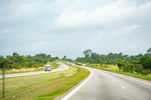 Road landscape on the Ivorian highway in the heart of the green savannah
