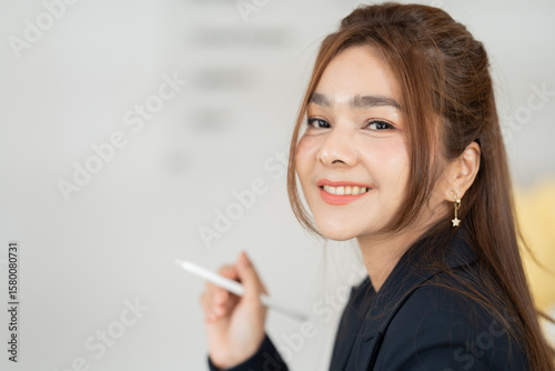 As a dedicated leader, the Asian female executive transforms her office culture by integrating innovation across finance departments, improving investment risk analysis, and refining management.
