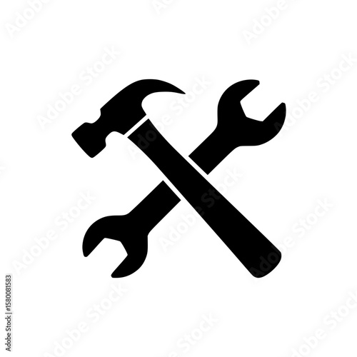 Hammer and wrench silhouette crossed