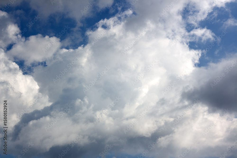 Fototapeta premium Beautiful cloud formations over Tyrol, Austria, showcasing the changing weather in the region during a sunny day