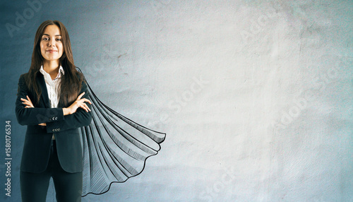 Confident businesswoman in suit with drawn superhero cape on textured wall background, symbolizing leadership, success, and empowerment concept.