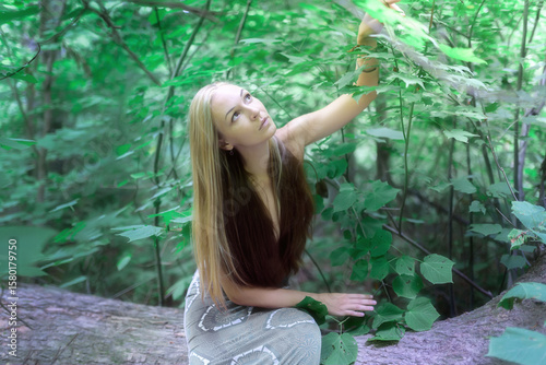 Woman in the forest. Enjoying nature.