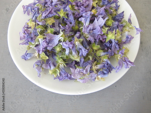 Dried mallow flowers on a small plate
