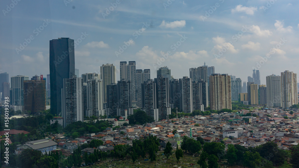 Fototapeta premium Modern Skyscrapers and Residential Housing in Jakarta Cityscape, Indonesia