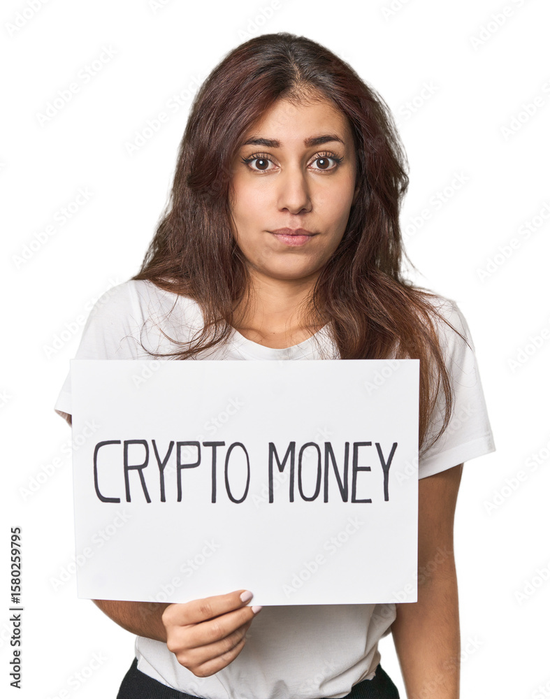 Middle Eastern woman with crypto sign shrugs shoulders and open eyes confused. Middle Eastern woman with crypto sign shrugs shoulders and open eyes confused.