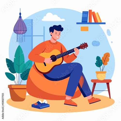 A young man relaxes at home playing his acoustic guitar, sitting on a comfortable beanbag chair amidst plants, bookshelf, creating a cozy and creative atmosphere.