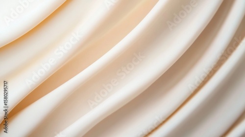 Elegant draped fabric showcasing smooth curves and soft textures in neutral hue