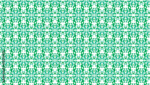 A seamless tie-dye pattern featuring intricate green and turquoise motifs, reminiscent of shibori dyeing techniques for textile design.