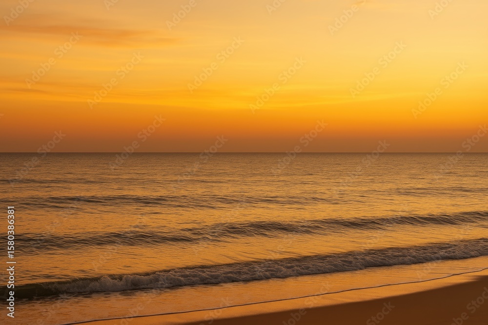 Obraz premium Serene ocean view at dusk with warm golden tones and calm waters, perfect for relaxation, meditation, or nature themes
