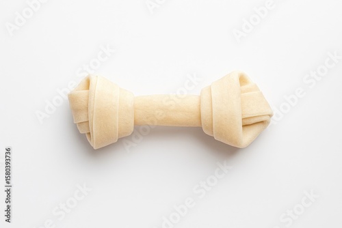 Bird's-eye perspective of a knotted dog bone designed for chewing on a plain white surface