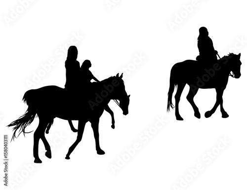 Silhouette of Two Horse Riders and Woman with Child Riding Horse