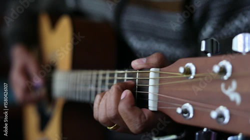A man playing a guitar