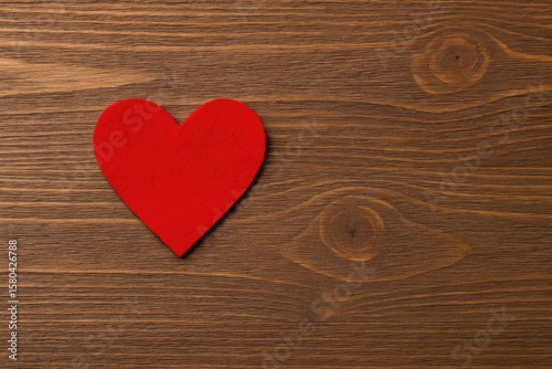 Felted Red Heart Displayed on Wooden Surface